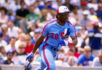 Outfielder Tim Raines of the Montreal Expos drops his bat and prepares to run.