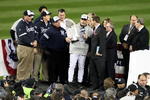 NEW YORK - NOVEMBER 04:  Manager Joe Girardi of the New York Yankees is interviewed as he celebrates with the trophy after their 7-3 win against the Philadelphia Phillies in Game Six of the 2009 MLB World Series at Yankee Stadium on November 4, 2009 in the Bronx borough of New York City.  (Photo by Al Bello/Getty Images)
