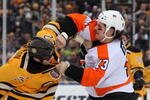 BOSTON - JANUARY 01:  Dan Carcillo #3 of the Philadelphia Flyers fights against Shawn Thornton #22 of the Boston Bruins during the first period of the 2010 Bridgestone Winter Classic at Fenway Park on January 1, 2010 in Boston, Massachusetts.  (Photo by Jim McIsaac/Getty Images)