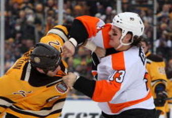 BOSTON - JANUARY 01:  Dan Carcillo #3 of the Philadelphia Flyers fights against Shawn Thornton #22 of the Boston Bruins during the first period of the 2010 Bridgestone Winter Classic at Fenway Park on January 1, 2010 in Boston, Massachusetts.  (Photo by Jim McIsaac/Getty Images)