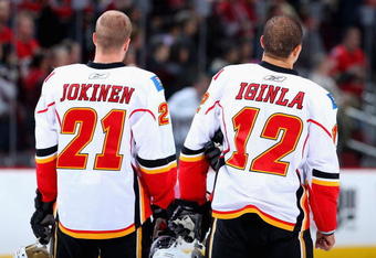 GLENDALE, AZ - DECEMBER 03:  Olli Jokinen#21 and Jarome Iginla #12 of the Calgary Flames stand for the National Anthem before the NHL game against the Phoenix Coyotes at Jobing.com Arena on December 3, 2009 in Glendale, Arizona.  The Coyotes defeated the Flames 2-1.  (Photo by Christian Petersen/Getty Images)