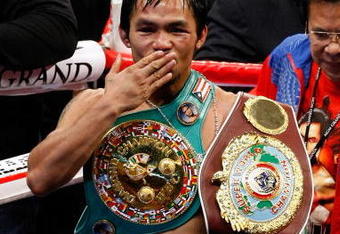 LAS VEGAS - NOVEMBER 14:  Manny Pacquiao celebrates his 12 round TKO victory against Miguel Cotto during their WBO welterweight title fight at the MGM Grand Garden Arena on November 14, 2009 in Las Vegas, Nevada.   (Photo by Ethan Miller/Getty Images)