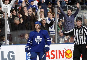 TORONTO - DECEMBER 26: Ian White #7 of the Toronto Maple Leafs celebrates his 2nd period goal against the Montreal Canadiens during their NHL game at the Air Canada Centre December 26, 2009 in Toronto, Ontario.(Photo By Dave Sandford/Getty Images)
