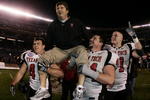 SAN DIEGO - DECEMBER 30:  Head Coach Mike Leach of the Texas Tech Red Raiders gets carried off the field after his team's 45-31 win over the California Golden Bears during the Pacific Life Holiday Bowl at Qualcomm Stadium December 30, 2004 in San Diego, California.  (Photo by Donald Miralle/Getty Images)