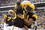 PITTSBURGH - DECEMBER 27:  Santonio Holmes #10 of the Pittsburgh Steelers celebrates a second quarter touchdown with Mike Wallace #17 while playing the Baltimore Ravens on December 27, 2009 at Heinz Field in Pittsburgh, Pennsylvania.  (Photo by Gregory Shamus/Getty Images)