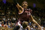 DURHAM, NC - JANUARY 06:  Deron Washington #13 of the Virginia Tech Hokies goes to the basket over Greg Paulus #3 of the Duke Blue Devils during their game on January 6, 2007 at Cameron Indoor Stadium in Durham, North Carolina.  (Photo by Streeter Lecka/Getty Images)