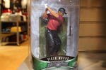 LOS ANGELES, CA - DECEMBER 11:  A figurine of golf legend Tiger Woods stands on a Champs sporting goods store shelf on December 11, 2009 in Los Angeles, California. Woods announced that he will take an indefinite break from professional golf to concentrate on repairing family relations after admitting to infidelity in his marriage.  (Photo by David McNew/Getty Images)