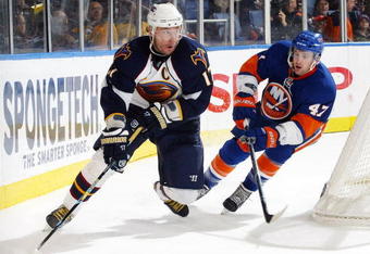UNIONDALE, NY - JANUARY 02: Ilya Kovalchuk #17 of the Atlanta Thrashers is pressured by Andrew MacDonald #47 of the New York Islanders during their game at the Nassau Coliseum on January 02, 2010 in Uninodale, New York. (Photo by Andy Marlin/Getty Images)