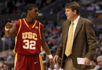 LOS ANGELES, CA - MARCH 14:  Head coach Tim Floyd of the USC Trojans directs O.J. Mayo #32 on the sidelines during the semifinals of the 2008 Pacific Life Pac-10 Men's Basketball Tournament Day Three against the UCLA Bruins at Staples Center on March 14, 2008 in Los Angeles, California.  (Photo by Stephen Dunn/Getty Images)
