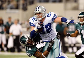 ARLINGTON, TX - JANUARY 03:  Tight end Jason Witten #82 of the Dallas Cowboys is tackled by Will Witherspoon #50 of the Philadelphia Eagles at Cowboys Stadium on January 3, 2010 in Arlington, Texas.  (Photo by Ronald Martinez/Getty Images)