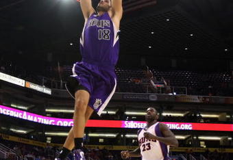 PHOENIX - OCTOBER 20:  Omri Casspi #18 of the Sacramento Kings slam dunks the ball against the Phoenix Suns during the NBA preseason game at US Airways Center on October 20, 2009 in Phoenix, Arizona. The Suns defeated the Kings 143-127.  NOTE TO USER: User expressly acknowledges and agrees that, by downloading and or using this photograph, User is consenting to the terms and conditions of the Getty Images License Agreement.  (Photo by Christian Petersen/Getty Images)