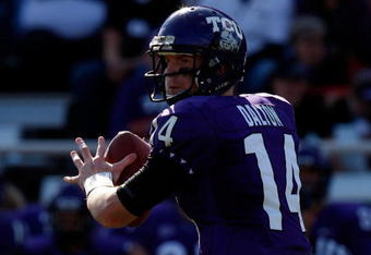 FORT WORTH, TX - NOVEMBER 28:  Quarterback Andy Dalton #14 of the TCU Horned Frogs drops back to pass against the New Mexico Lobos at Amon G. Carter Stadium on November 28, 2009 in Fort Worth, Texas.  (Photo by Ronald Martinez/Getty Images)