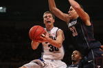 NEW YORK - NOVEMBER 27:  Jon Scheyer #30 of the Duke Blue Devils lays the ball up under Gavin Edwards #33 of the Connecticut Huskies during the Championship game at Madison Square Garden on November 27, 2009 in New York, New York.  (Photo by Nick Laham/Getty Images)