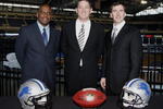 DETROIT , MI - JANUARY 16:  Jim Schwartz, center, head coach of the Detroit Lions poses with General Manager Martin Mayhew, left, and Tom Lewand team president after a press conference to introduce him as the Lions new head coach on January 16, 2009 at Ford Field in Detroit, Michigan.  (Photo by Gregory Shamus/Getty Images)
