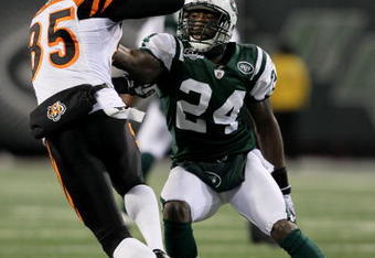 EAST RUTHERFORD, NJ - JANUARY 03:  Chad Ochocinco #85 of the Cincinnati Bengals runs past Darrelle Revis #24 of the New York Jets in the second quarter at Giants Stadium on January 3, 2010 in East Rutherford, New Jersey.  (Photo by Al Bello/Getty Images)