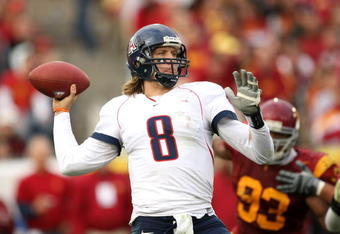 LOS ANGELES - DECEMBER 5:  Quarterback Nick Foles #8 of the Arizona Wildcats throws a pass against the USC Trojans on December 5, 2009 at the Los Angeles Coliseum in Los Angeles, California. Arizona won 21-17.   (Photo by Stephen Dunn/Getty Images)