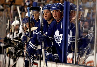 TORONTO - SEPTEMBER 22:  Mike Komisarek #8 and Tomas Kaberle #15 of the Toronto Maple Leafs watch from the bench during a pre-season  NHL game against the Pittsburgh Penguins at the Air Canada Centre on September 22, 2009 in Toronto, Ontario, Canada .  (Photo by Abelimages/Getty Images) 