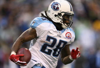 SEATTLE - JANUARY 03:  Running back Chris Johnson #28 of the Tennessee Titans rushes against the Seattle Seahawks on January 3, 2010 at Qwest Field in Seattle, Washington. The Titans defeated the Seahawks 17-13. (Photo by Otto Greule Jr/Getty Images)