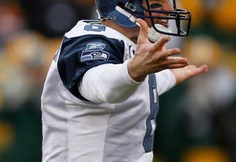 GREEN BAY, WI - DECEMBER 27: Matt Hasselbeck #8 of the Seattle Seahawks complains to a referee after being sacked by Brandon Chillar of the Green Bay Packers at Lambeau Field on December 27, 2009 in Green Bay, Wisconsin. The Packers defeated the Seahawks 48-10. (Photo by Jonathan Daniel/Getty Images)