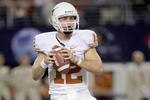 ARLINGTON, TX - DECEMBER 5: Colt McCoy #12 of the Texas Longhorns looks to pass the ball during the Big 12 Football Championship game against the Nebraska Cornhuskers at Cowboys Stadium on December 5, 2009 in Arlington, Texas. (Photo by Jamie Squire/Getty Images)
