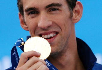 ROME - AUGUST 02:  Michael Phelps of the United States receives the gold medal during the medal ceremony for the Men's 4x 100m Medley Relay Final during the 13th FINA World Championships at the Stadio del Nuoto on August 2, 2009 in Rome, Italy.  (Photo by Quinn Rooney/Getty Images)