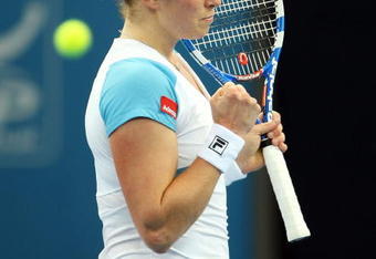 BRISBANE, AUSTRALIA - JANUARY 05:  Kim Clijsters of Belgium celebrates winning her second round match against Alicia Molik of Australia during day three of the Brisbane International 2010 at Queensland Tennis Centre on January 5, 2010 in Brisbane, Australia.  (Photo by Mark Kolbe/Getty Images)