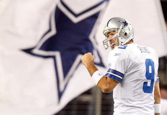 ARLINGTON, TX - JANUARY 03:  Quarterback Tony Romo #9 of the Dallas Cowboys celebrates a touchdown by Felix Jones against the Philadelphia Eagles at Cowboys Stadium on January 3, 2010 in Arlington, Texas.  (Photo by Ronald Martinez/Getty Images)