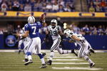 INDIANAPOLIS, IN - DECEMBER 27: Curtis Painter #7 of the Indianapolis Colts tries to pass the football while under pressure from Bryan Thomas #99 and Eric Smith #33 of the New York Jets at Lucas Oil Stadium on December 27, 2009 in Indianapolis, Indiana. The Jets handed the Colts their first loss of the season, 29-15. (Photo by Joe Robbins/Getty Images)
