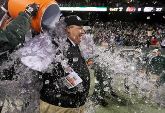 EAST RUTHERFORD, NJ - JANUARY 03:  Rex Ryan, Head Coach of the New York Jets, has Gatorade dumped on him by players at the end of the fourth quarter in celebration of their 37-0 victory over the Cincinnati Bengals at Giants Stadium on January 3, 2010 in East Rutherford, New Jersey.  (Photo by Al Bello/Getty Images)