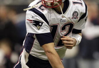 HOUSTON - JANUARY 03:  Quarterback Tom Brady #12 of the New England Patriots warms up before playing the Houston Texans at Reliant Stadium on January 3, 2010 in Houston, Texas.  (Photo by Bob Levey/Getty Images)