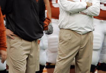 AUSTIN, TX - OCTOBER 10:  Defensive coordinator Will Muschamp and head coach Mack Brown of the Texas Longhorns lead their team in pregame drills before playing the Colorado Buffaloes  on October 10, 2009 at Darrell K Royal-Texas Memorial Stadium in Austin, Texas.  Texas won 38-14.  (Photo by Brian Bahr/Getty Images)