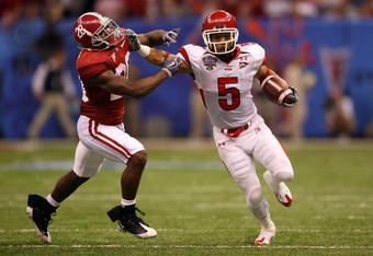 NEW ORLEANS - JANUARY 02:  Wide receiver Brent Casteel #5 of the Utah Utes attempts to avoid a tackle by Javier Arenas #28 of the Alabama Crimson Tide during the 75th Allstate Sugar Bowl at the Louisiana Superdome on January 2, 2009 in New Orleans, Louisiana. The Utes defeated the Tide 31-17. (Photo by Matthew Stockman/Getty Images)