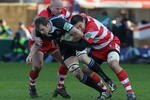 GLOUCESTER, ENGLAND - DECEMBER 20: Alastair Kellock of Glasgow is tackled by Nick Wood (L) and Gareth Delve during the Heineken Cup match between Gloucester and Glasgow Warriors at Kingsholm on December 20, 2009 in Gloucester, England.  (Photo by David Rogers/Getty Images)