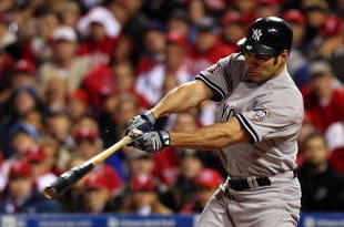 PHILADELPHIA - NOVEMBER 02:  Johnny Damon #18 of the New York Yankees hits a single in the top of the first inning against the Philadelphia Phillies in Game Five of the 2009 MLB World Series at Citizens Bank Park on November 2, 2009 in Philadelphia, Pennsylvania.  (Photo by Nick Laham/Getty Images)