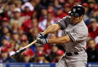 PHILADELPHIA - NOVEMBER 02:  Johnny Damon #18 of the New York Yankees hits a single in the top of the first inning against the Philadelphia Phillies in Game Five of the 2009 MLB World Series at Citizens Bank Park on November 2, 2009 in Philadelphia, Pennsylvania.  (Photo by Nick Laham/Getty Images)