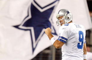 ARLINGTON, TX - JANUARY 03:  Quarterback Tony Romo #9 of the Dallas Cowboys celebrates a touchdown by Felix Jones against the Philadelphia Eagles at Cowboys Stadium on January 3, 2010 in Arlington, Texas.  (Photo by Ronald Martinez/Getty Images)