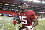 ATLANTA - DECEMBER 5:  Rolando McClain #25 of the Alabama Crimson Tide carries a rose as he runs of the field after their 32-13 win against the Florida Gators during the SEC Championship game at Georgia Dome on December 5, 2009 in Atlanta, Georgia.  (Photo by Kevin C. Cox/Getty Images)