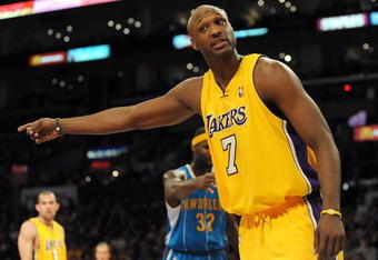 LOS ANGELES, CA - DECEMBER 01:  Lamar Odom #7 of the Los Angeles Lakers argues for possesion of the ball during the game against the New Orleans Hornets at Staples Center on December 1, 2009 in Los Angeles, California.  (Photo by Harry How/Getty Images) NOTE TO USER: User expressly acknowledges and agrees that, by downloading and/or using this Photograph, user is consenting to the terms and conditions of the Getty Images License Agreement.