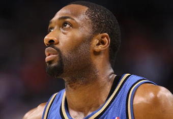 PHOENIX - DECEMBER 19:  Gilbert Arenas #0 of the Washington Wizards during the NBA game against the Phoenix Suns at US Airways Center on December 19, 2009 in Phoenix, Arizona. The Suns defeated the Wizards 121-95. NOTE TO USER: User expressly acknowledges and agrees that, by downloading and or using this photograph, User is consenting to the terms and conditions of the Getty Images License Agreement.  (Photo by Christian Petersen/Getty Images)