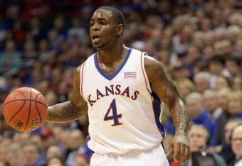LAWRENCE, KS - DECEMBER 19:  Sherron Collins #4 of the Kansas Jayhawks dribbles the ball during the game against the Michigan Wolverines on December 19, 2009 at Allen Fieldhouse in Lawrence, Kansas. (Photo by Jamie Squire/Getty Images)
