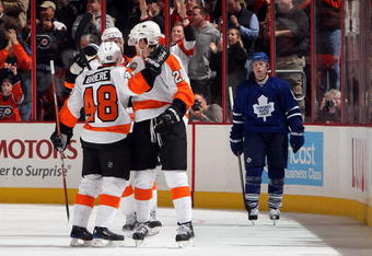 PHILADELPHIA - JANUARY 06:  Daniel Briere #48 of the Philadelphia Flyers celebrates his second goal as Jason Blake #55 of the Toronto Maple Leafs looks on January 6, 2010 at Wachovia Center in Philadelphia, Pennsylvania. The Flyers defeated the Leafs 6-2. The goal was the 500th point of Briere's career.  (Photo by Jim McIsaac/Getty Images)