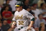 BOSTON - JULY 28:  Jack Cust #32 of the Oakland Athletics scores a run in the ninth inning against the Boston Red Sox at Fenway Park July 28, 2009 in Boston, Massachusetts.  (Photo by Elsa/Getty Images)