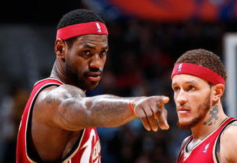 ATLANTA - DECEMBER 29:  LeBron James #23 of the Cleveland Cavaliers converses with Delonte West #13 against the Atlanta Hawks at Philips Arena on December 29, 2009 in Atlanta, Georgia.  NOTE TO USER: User expressly acknowledges and agrees that, by downloading and/or using this Photograph, User is consenting to the terms and conditions of the Getty Images License Agreement.  (Photo by Kevin C. Cox/Getty Images)