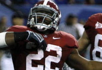 ATLANTA - DECEMBER 5:  (L-R) Mark Ingram #22, Colin Peek #84 and Roy Upchurch #5 of the Alabama Crimson Tide celebrate after Ingram scored a 3-yard rushing touchdown in the second quarter against the Florida Gators during the SEC Championship game at Georgia Dome on December 5, 2009 in Atlanta, Georgia.  (Photo by Chris Graythen/Getty Images)