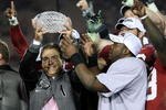 PASADENA, CA - JANUARY 07:  Head coach Nick Saban and running back Mark Ingram #22 of the Alabama Crimson Tide celebrate with the BCS Championship trophy after winning the Citi BCS National Championship game over the Texas Longhorns at the Rose Bowl on January 7, 2010 in Pasadena, California. The Crimson Tide defeated the Longhorns 37-21.  (Photo by Stephen Dunn/Getty Images)