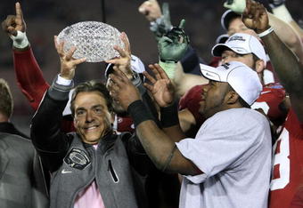 PASADENA, CA - JANUARY 07:  Head coach Nick Saban and running back Mark Ingram #22 of the Alabama Crimson Tide celebrate with the BCS Championship trophy after winning the Citi BCS National Championship game over the Texas Longhorns at the Rose Bowl on January 7, 2010 in Pasadena, California. The Crimson Tide defeated the Longhorns 37-21.  (Photo by Stephen Dunn/Getty Images)