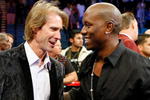 LAS VEGAS - SEPTEMBER 19:  Director Michael Bay (L) and actor/singer Tyrese Gibson talk in the ring after Floyd Mayweather Jr. defeated Juan Manuel Marquez in a unanimous decision at the MGM Grand Garden Arena September 19, 2009 in Las Vegas, Nevada.  (Photo by Ethan Miller/Getty Images)