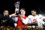 PASADENA, CA - JANUARY 01:  (C) Head coach Jim Tressel of the Ohio State Buckeyes celebrates with the Rose Bowl championship trophy as quarterback Terrelle Pryor #2 looks on after the buckeyes 26-17 win in the 96th Rose Bowl game over the Oregon Ducks on January 1, 2010 in Pasadena, California.  (Photo by Kevork Djansezian/Getty Images)