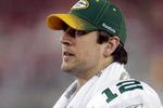 GLENDALE, AZ - JANUARY 03:  Quarterback Aaron Rodgers #12 of the Green Bay Packers looks on from the sideline against the Arizona Cardinals at University of Phoenix Stadium on January 3, 2010 in Glendale, Arizona.  (Photo by Jamie Squire/Getty Images)