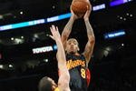 LOS ANGELES, CA - DECEMBER 29:  Monta Ellis #8 of the Golden State Warriors shoots over Jordan Farmar #1 of the Los Angeles Lakers on December 29, 2009 at Staples Center in Los Angeles, California.  The Lakers won 124-118. NOTE TO USER: User expressly acknowledges and agrees that, by downloading and/or using this Photograph, user is consenting to the terms and conditions of the Getty Images License Agreement.  (Photo by Stephen Dunn/Getty Images)